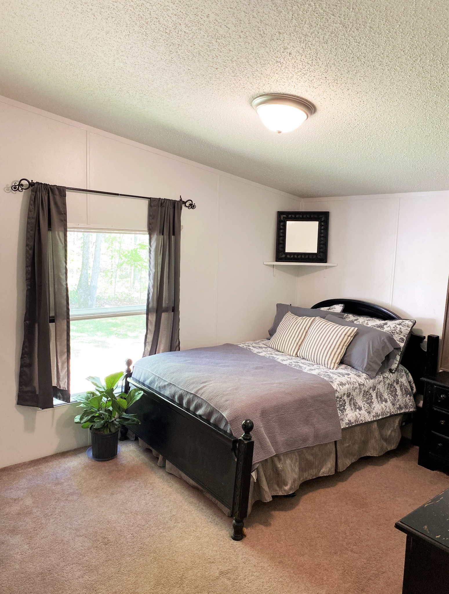 11277 Missionary Ridge Road Bon Aqua, TN 37025 - Photo 9 of 42 a bedroom with bed and a large window