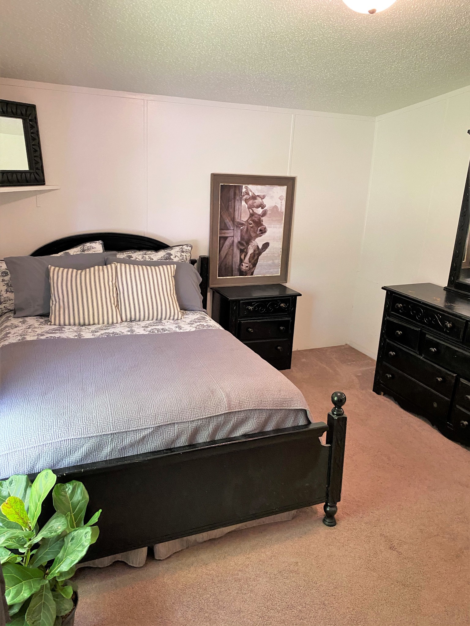 11277 Missionary Ridge Road Bon Aqua, TN 37025 - Photo 10 of 42 a bedroom with a bed and cabinets