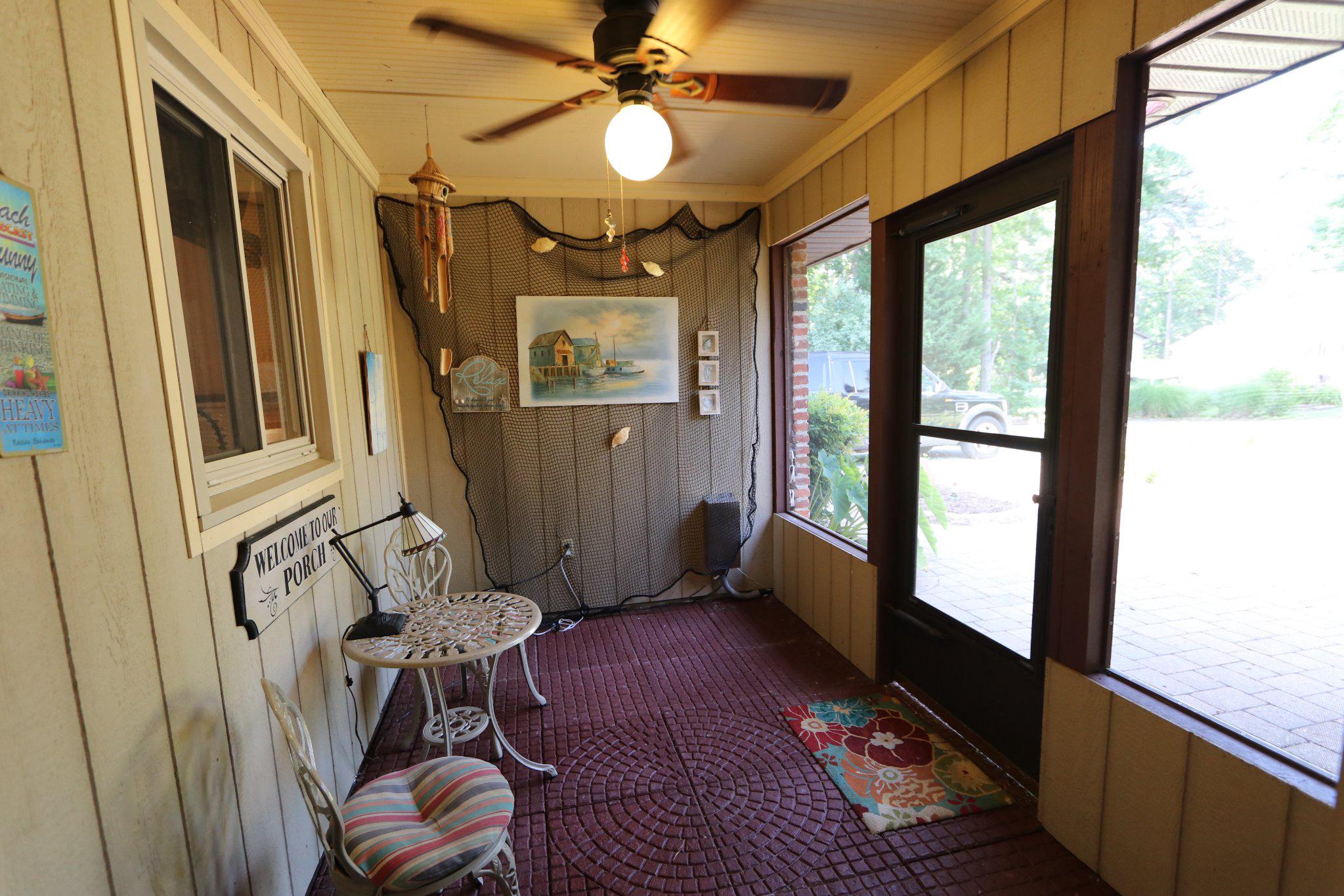 342 Wicomico Road Stevensville, MD 21666 - Photo 19 of 61 Charming screened entryway with rustic charm