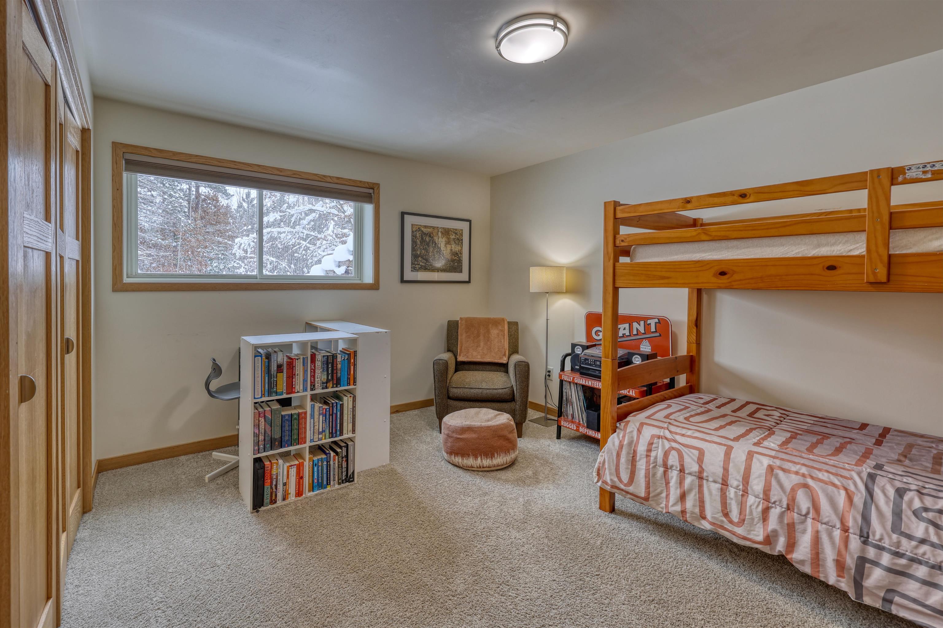 8056 North North Road Springbrook, WI 54875 - Photo 32 of 65 Bedroom featuring light carpet and baseboards