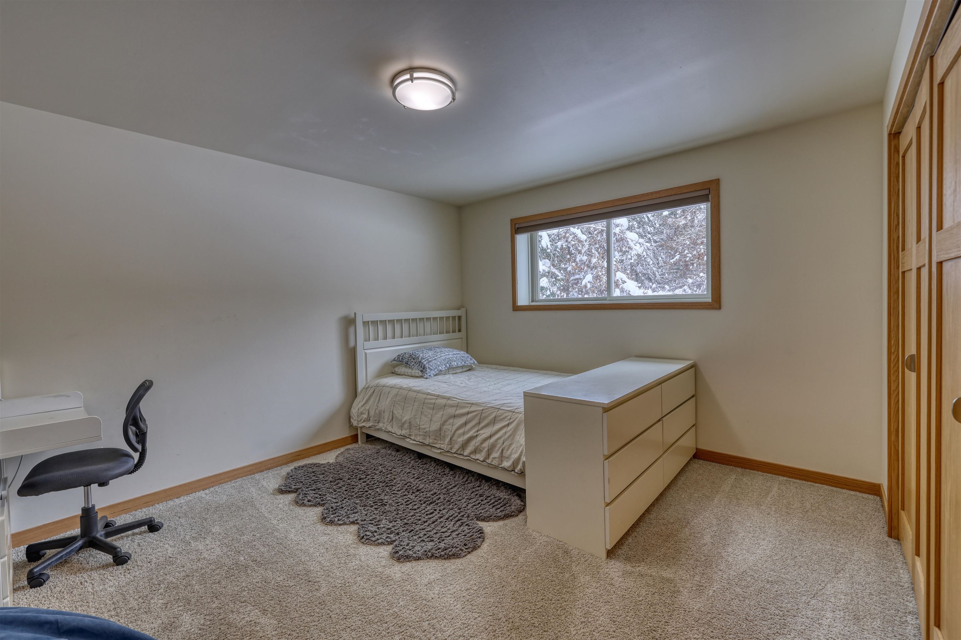 8056 North North Road Springbrook, WI 54875 - Photo 34 of 65 Bedroom with light carpet and baseboards