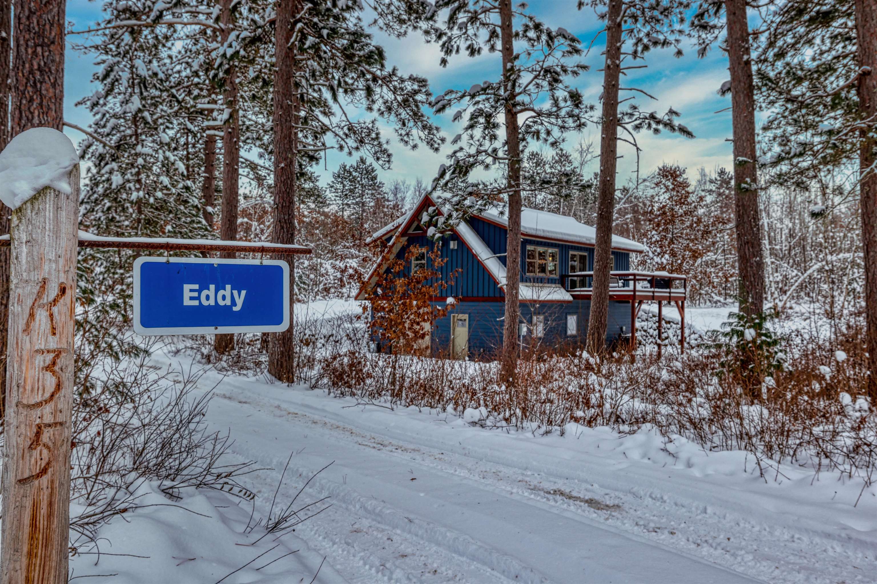 8056 North North Road Springbrook, WI 54875 - Photo 42 of 65 View of front of property with board and batten siding