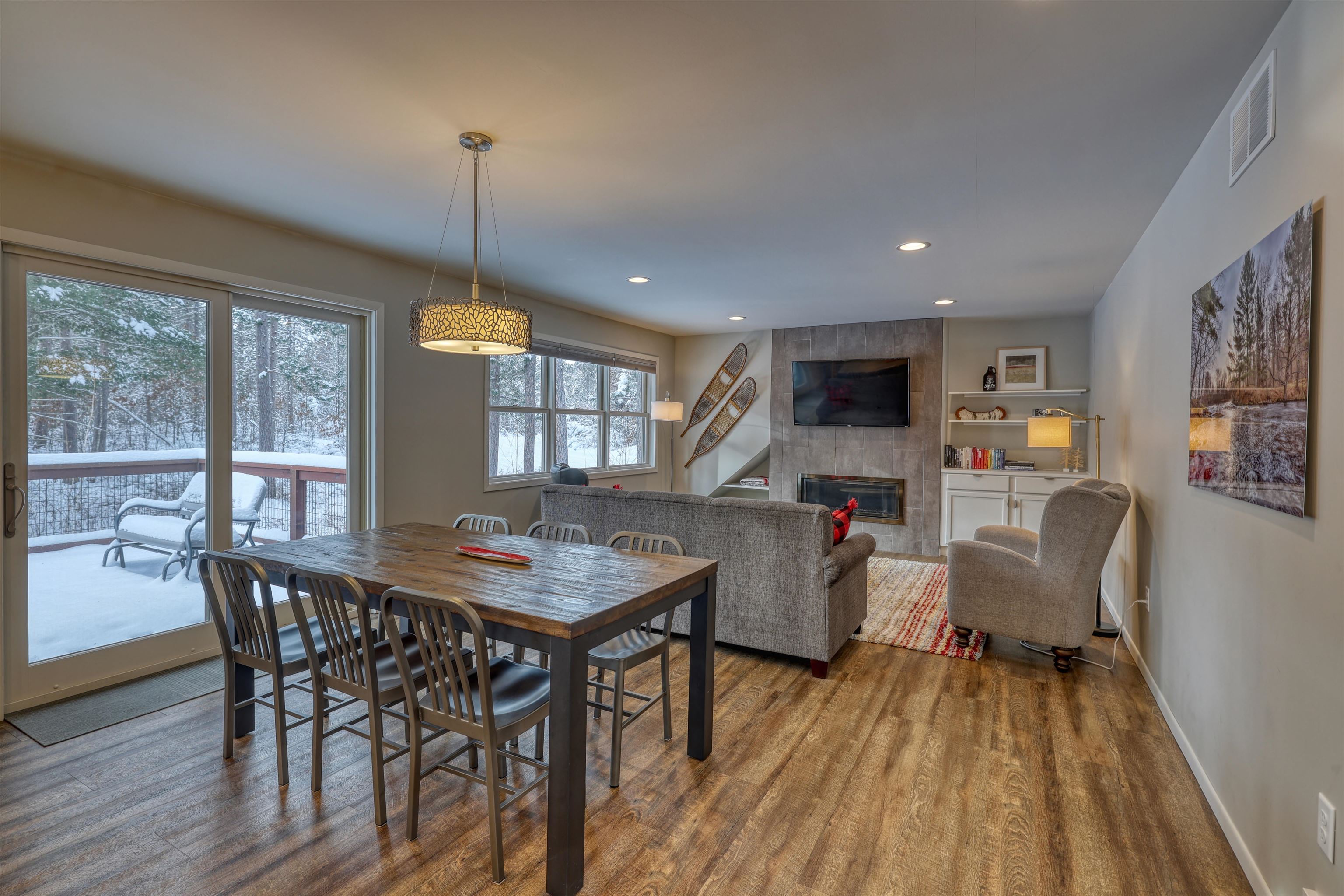 8056 North North Road Springbrook, WI 54875 - Photo 53 of 65 Dining area with a tiled fireplace, wood finished floors, and recessed lighting