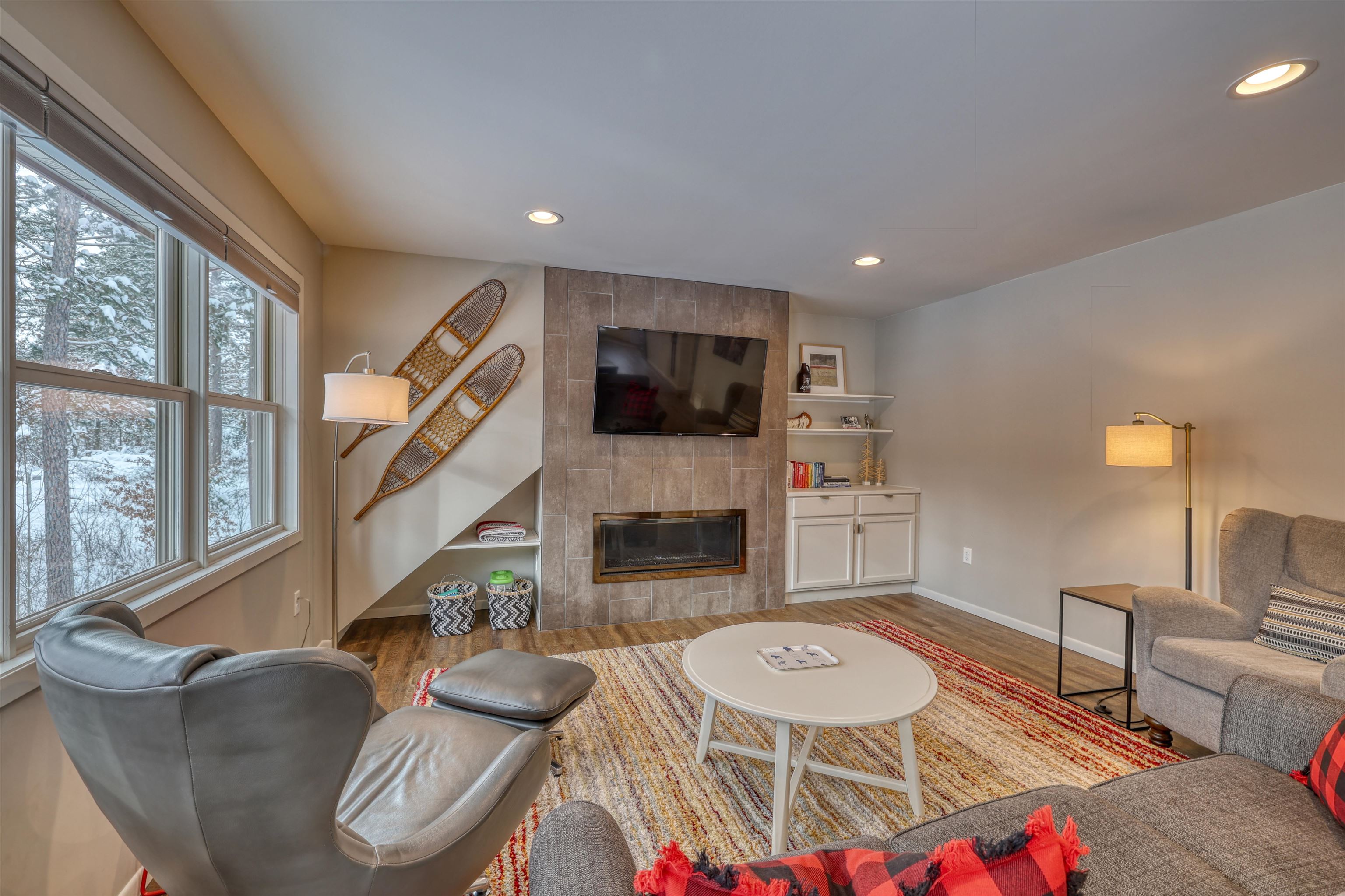 8056 North North Road Springbrook, WI 54875 - Photo 54 of 65 Living area with a tile fireplace, light wood finished floors, and recessed lighting