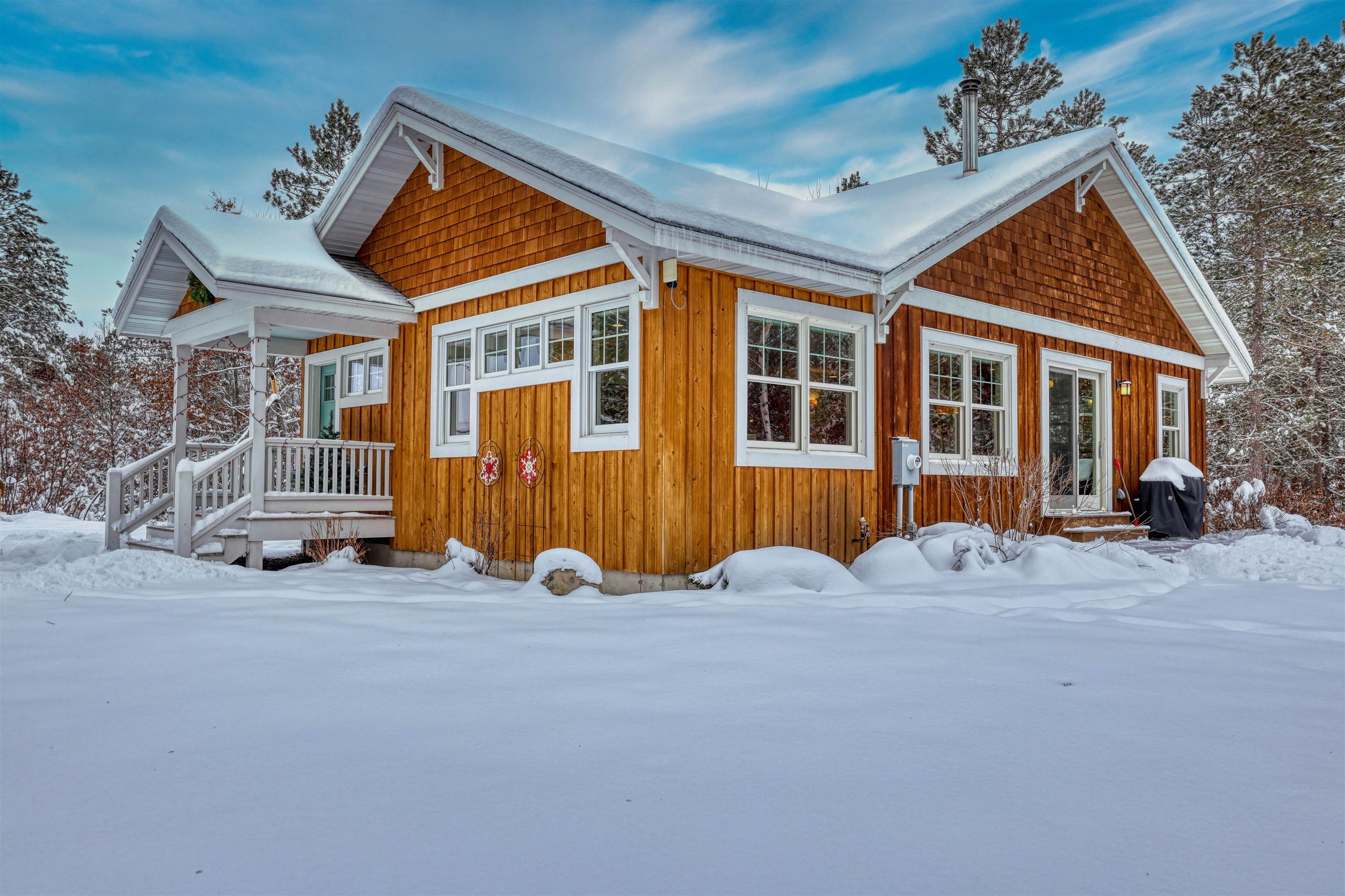 8056 North North Road Springbrook, WI 54875 - Photo 6 of 65 View of snow covered exterior featuring covered porch