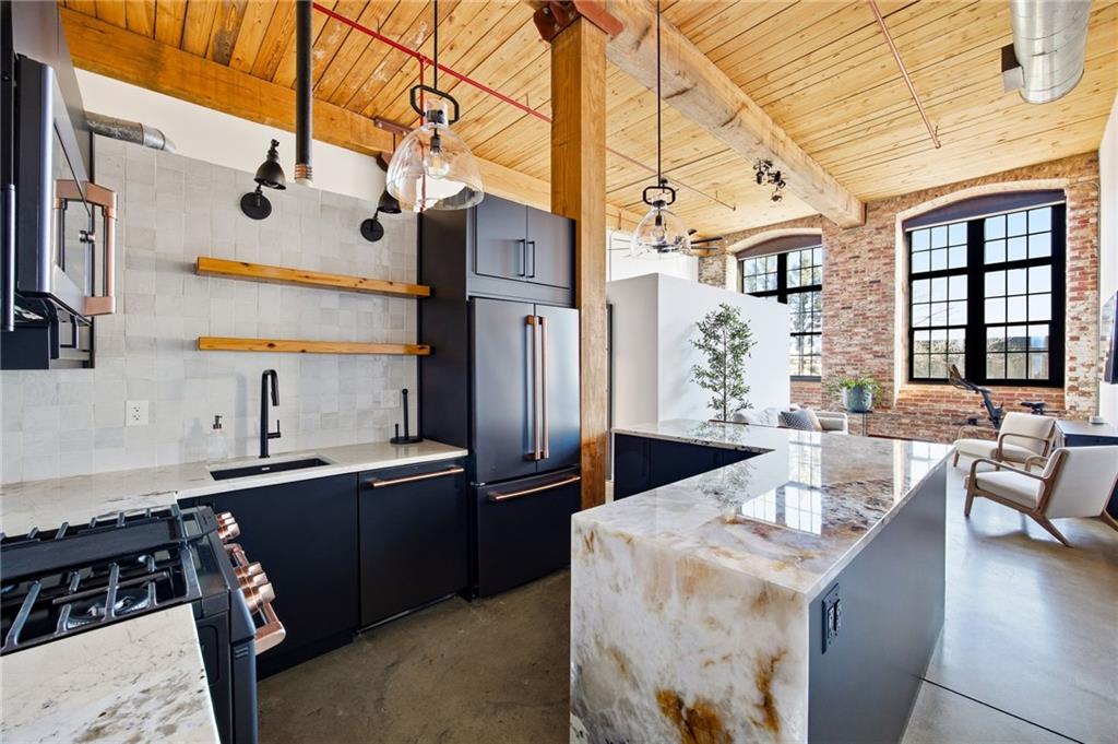 170 Boulevard Southeast, Unit H213 Atlanta, GA 30312 - Photo 1 of 22 a kitchen with stainless steel appliances granite countertop a sink and cabinets