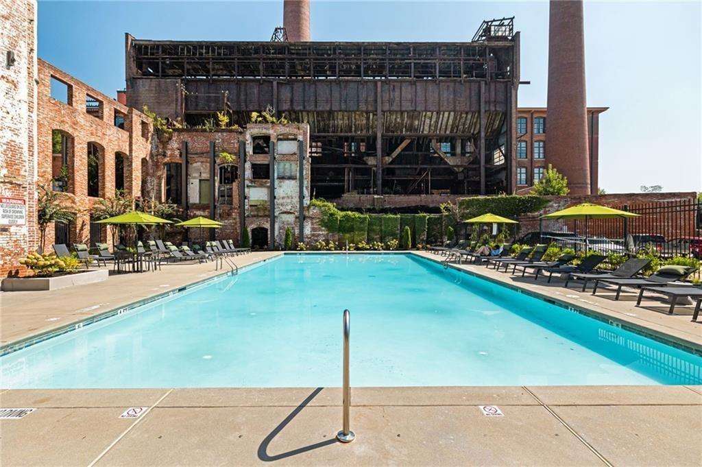170 Boulevard Southeast, Unit H213 Atlanta, GA 30312 - Photo 14 of 22 a street view with tall buildings and a yard