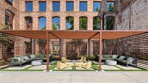a view of a brick building with many windows