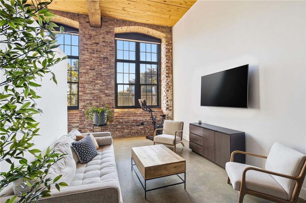 170 Boulevard Southeast, Unit H213 Atlanta, GA 30312 - Photo 6 of 22 a living room with furniture and a flat screen tv