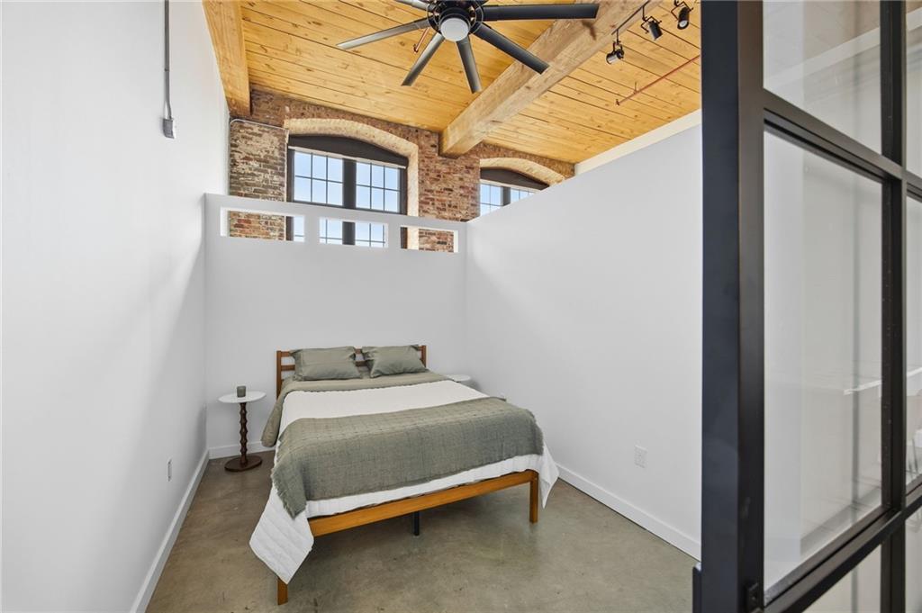 170 Boulevard Southeast, Unit H213 Atlanta, GA 30312 - Photo 9 of 22 a bedroom with a bed and a window