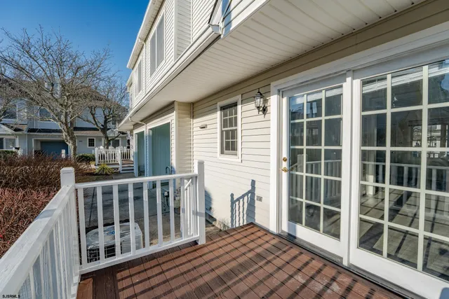 a front view of a house with a garden and pathway
