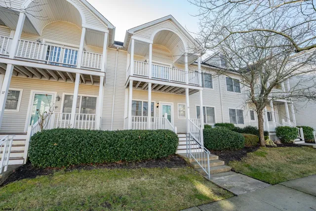 a view of a brick house with a large window