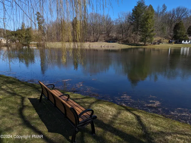 a view of a lake with a yard