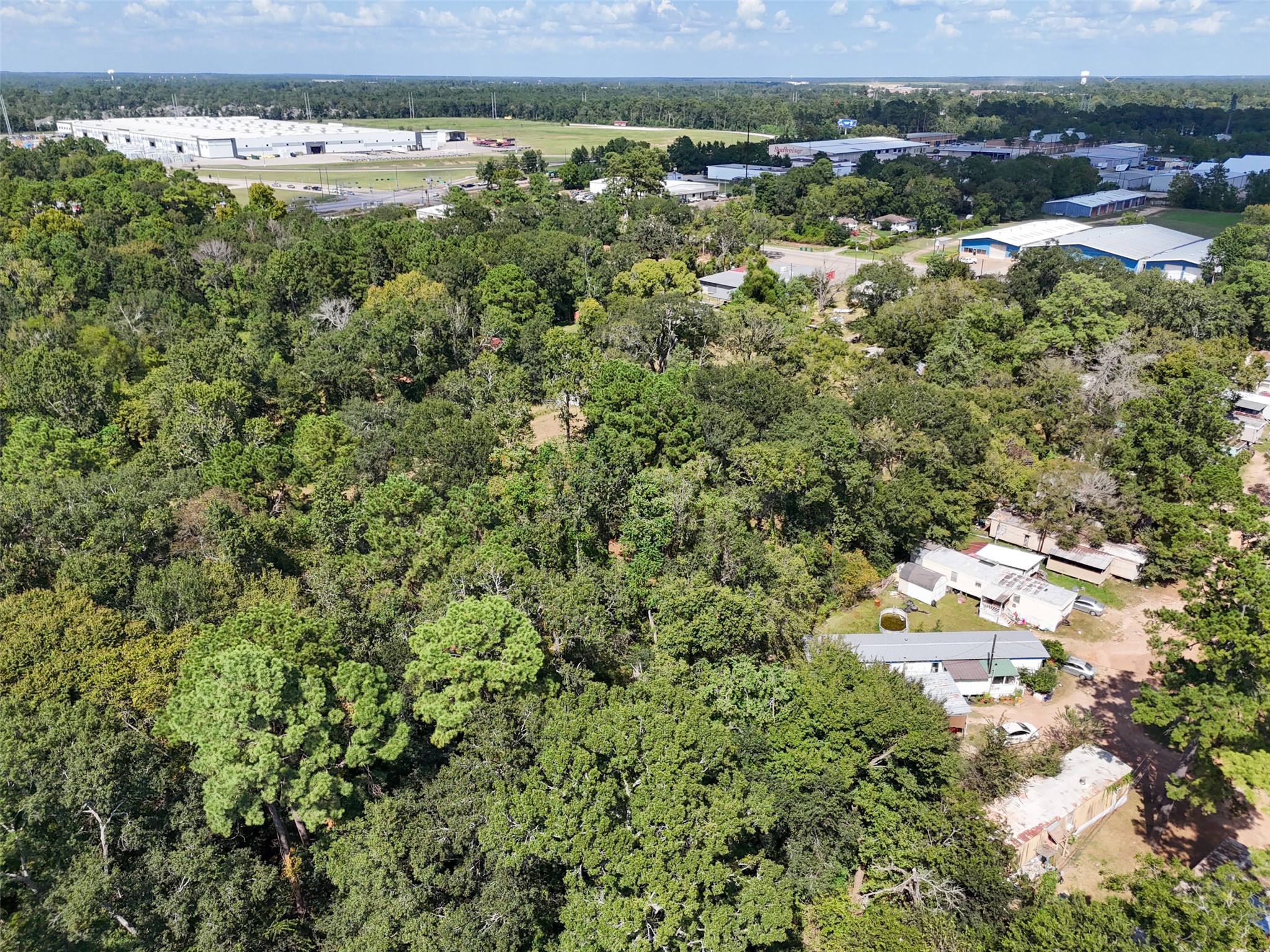 220 Porter Road Conroe, TX 77301 - Photo 12 of 23 an aerial view of residential houses with outdoor space and trees