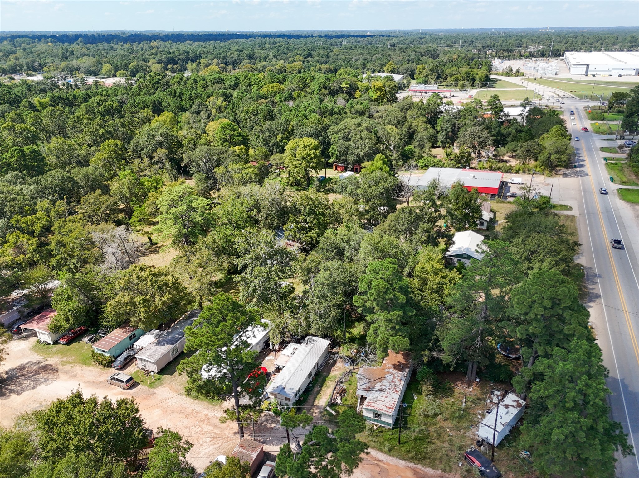 220 Porter Road Conroe, TX 77301 - Photo 15 of 23 an aerial view of residential houses with outdoor space and trees