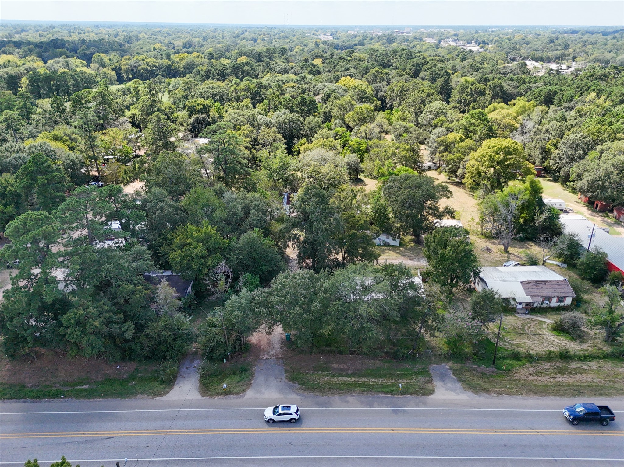 220 Porter Road Conroe, TX 77301 - Photo 2 of 23 an aerial view of a house with yard