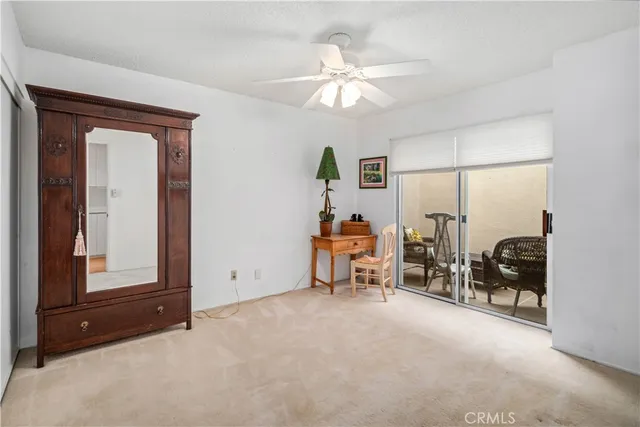 a view of a livingroom with furniture and a window