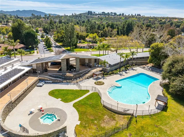 a view of a swimming pool with a patio