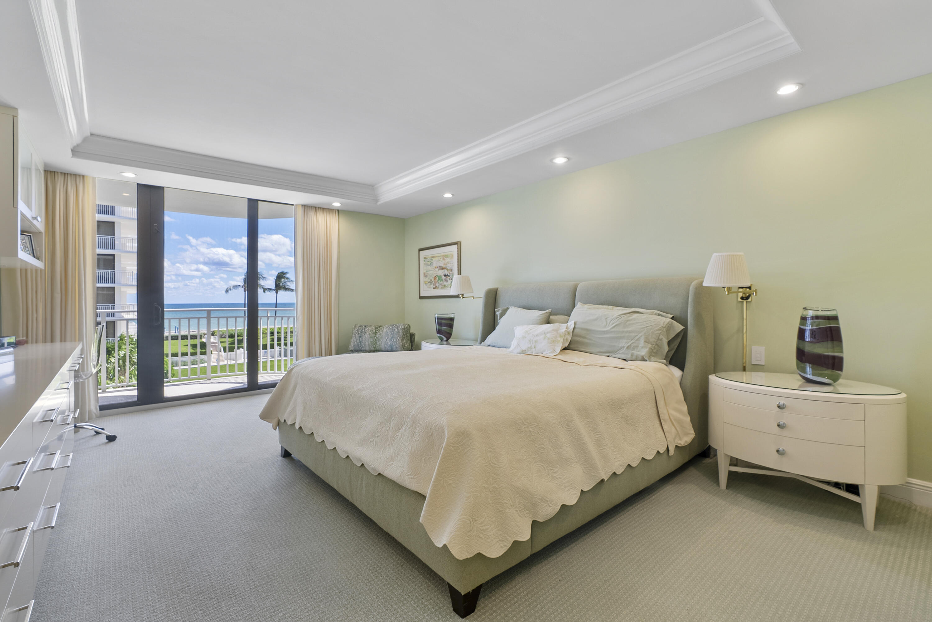 2580 South Ocean Boulevard, Unit 1C3 Palm Beach, FL 33480 - Photo 4 of 17 a bedroom with a large bed and a large window