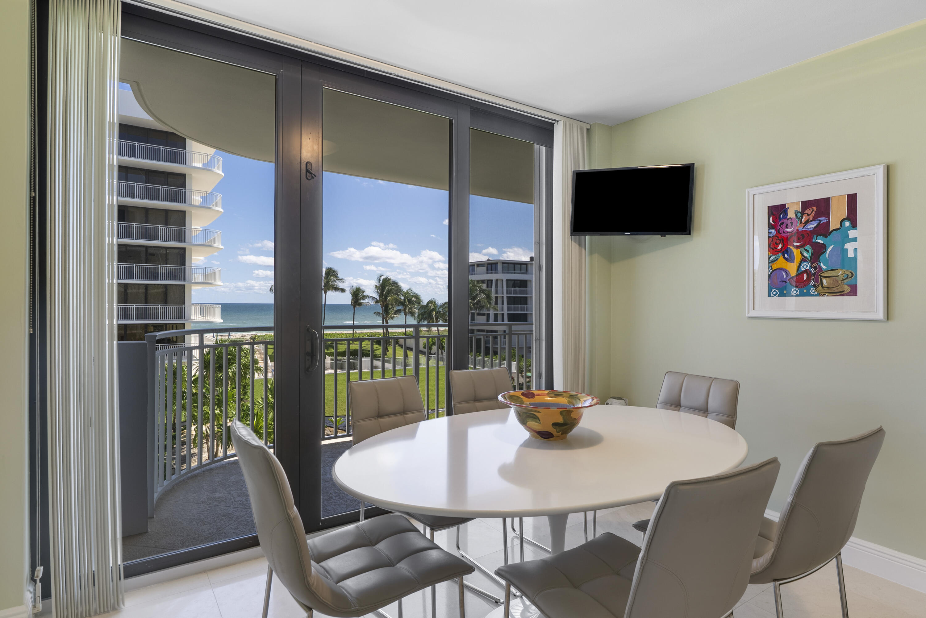 2580 South Ocean Boulevard, Unit 1C3 Palm Beach, FL 33480 - Photo 8 of 17 a view of a dining room with furniture window and outside view