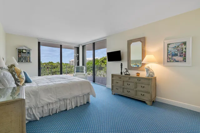 a bed room with a bed and a television