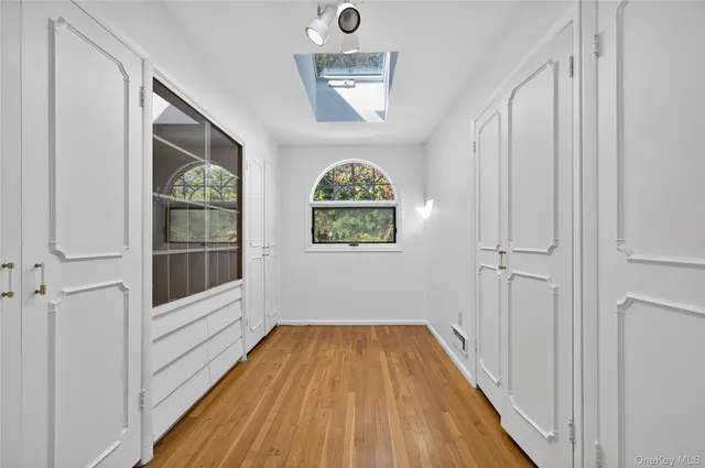 a view of front door with wooden floor