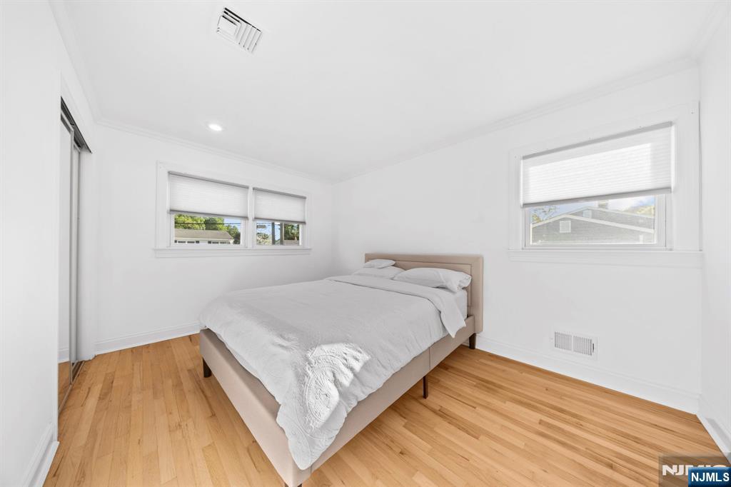 62 Sycamore Road Dumont, NJ 07628 - Photo 21 of 43 a bedroom with a bed and a window