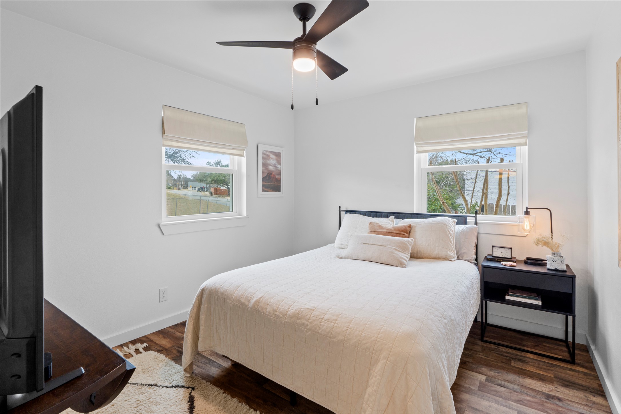 6809 Roanoke Drive Austin, TX 78723 - Photo 12 of 25 Bedroom with multiple windows, large closet and a ceiling fan