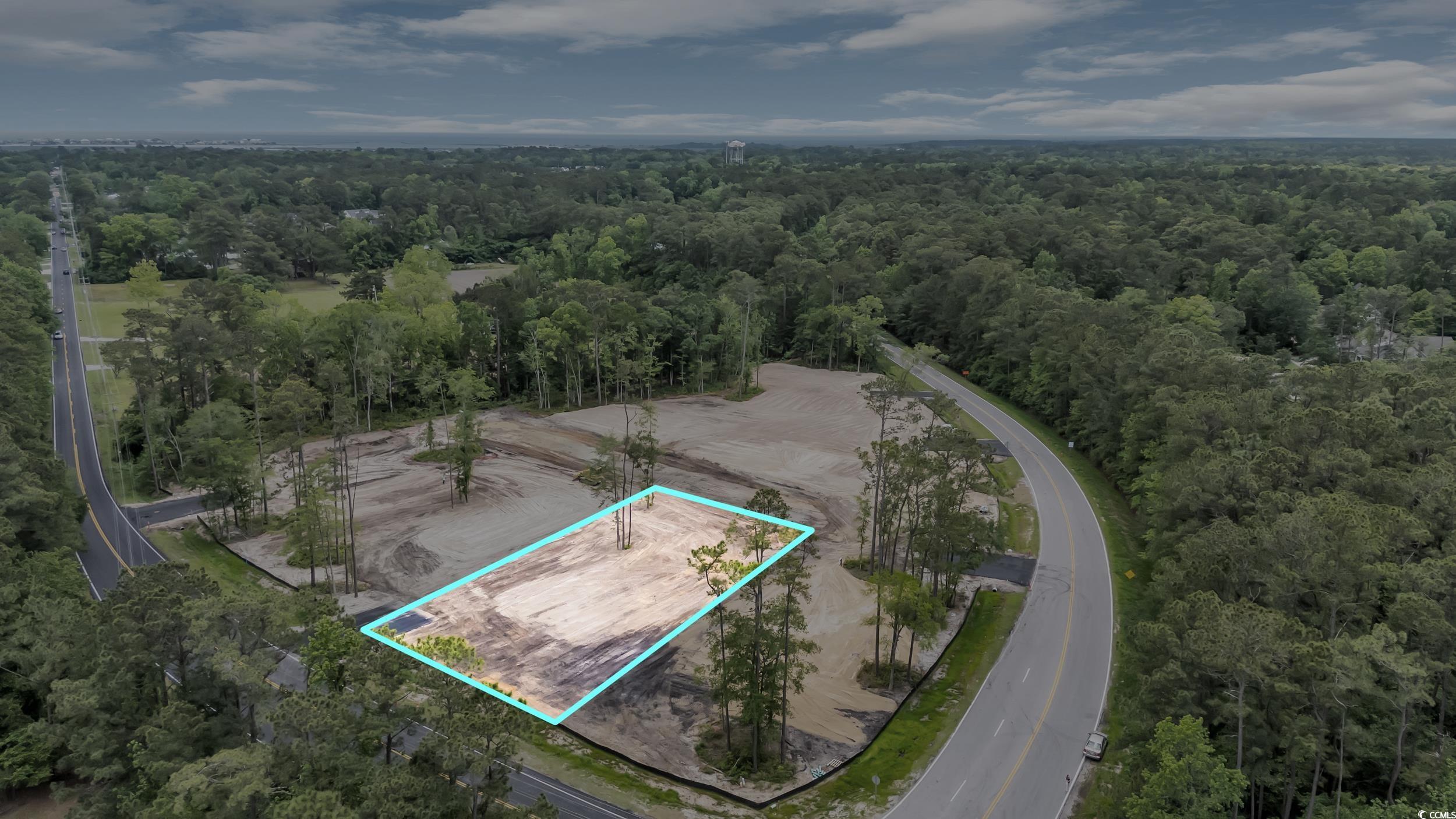 1095 Wachesaw Road Murrells Inlet, SC 29576 - Photo 8 of 17 Drone / aerial view featuring a wooded view
