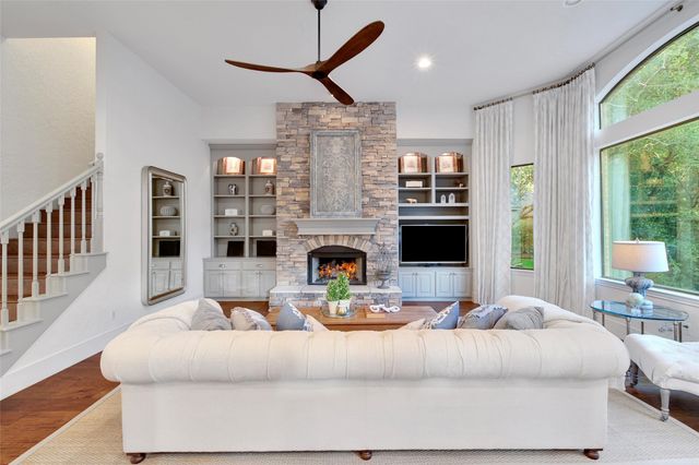 a kitchen with kitchen island granite countertop a stove and a sink