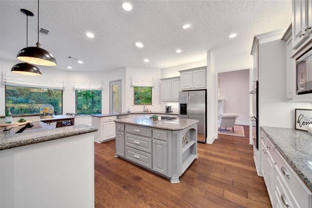 a kitchen with a stove and a sink