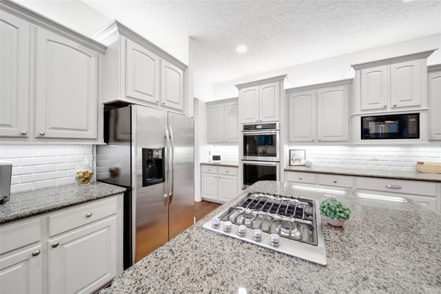 a kitchen with sink and window