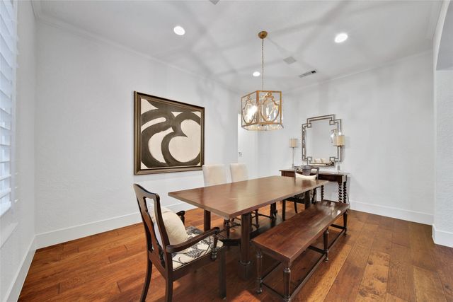 a workspace with wooden floor and a window