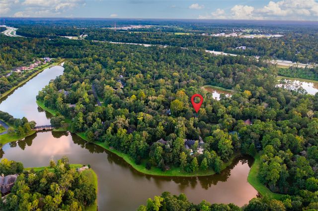 a view of a lake with a house in the background