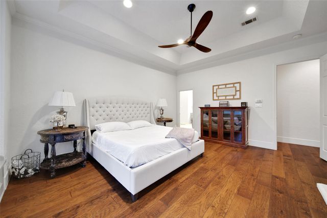 a bathroom with a granite countertop sink a toilet and bathtub