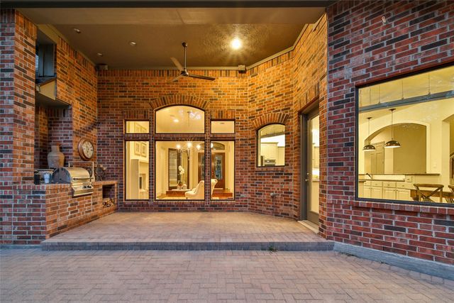 a view of swimming pool with an outdoor seating