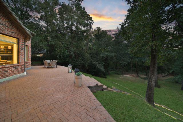 a view of a park with large trees