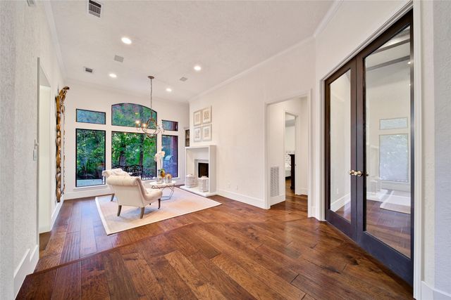 a living room with furniture fireplace and flat screen tv