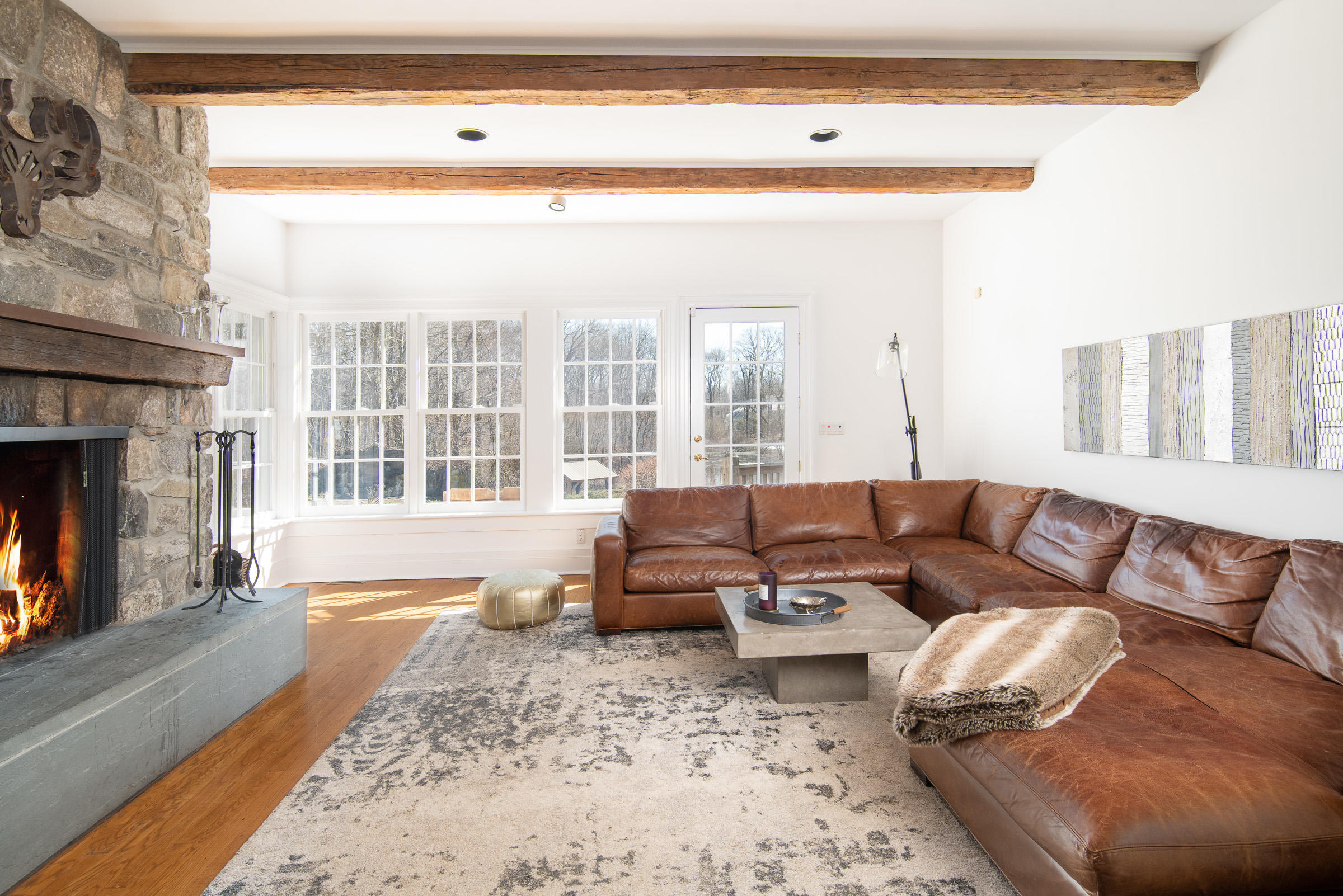 65 Sunset Hill Road New Canaan, CT 06840 - Photo 12 of 21 a living room with furniture and a fireplace