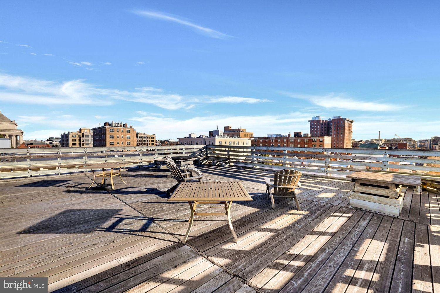 1725 17th Street Northwest, Unit 503 Washington, DC 20009 - Photo 18 of 24 a view of a roof deck with patio and ocean view