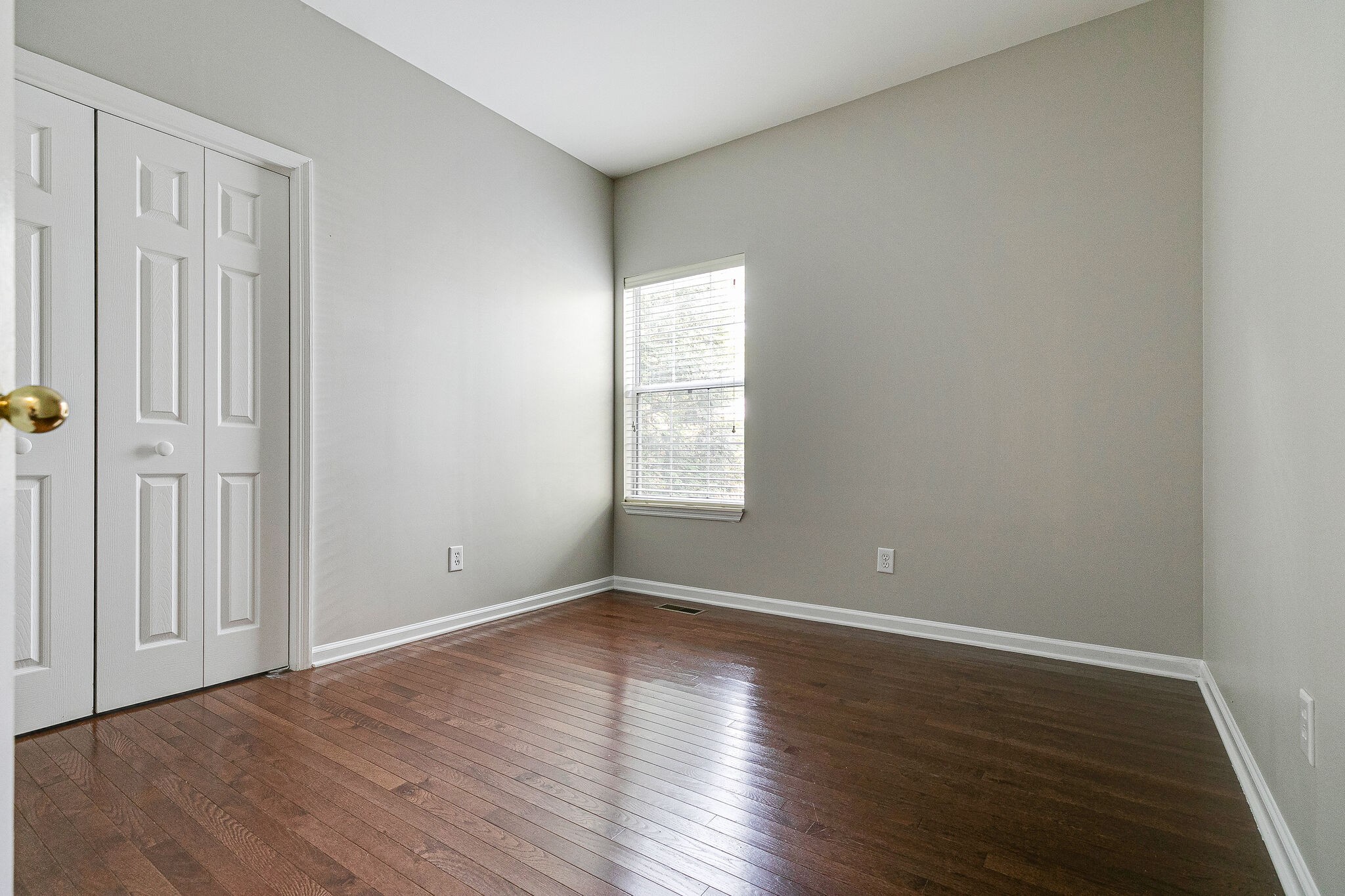 320 Cannonade Circle Franklin, TN 37069 - Photo 21 of 30 a view of an empty room with wooden floor and a window
