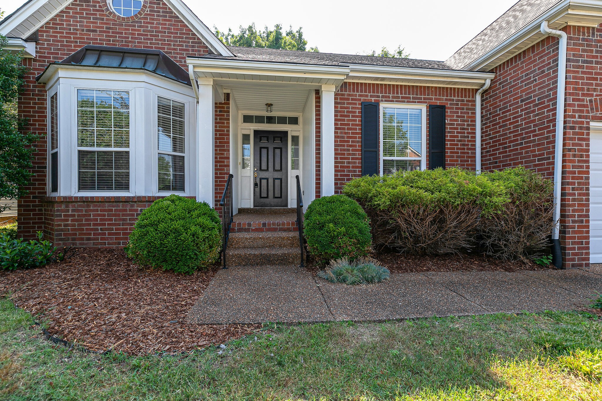 320 Cannonade Circle Franklin, TN 37069 - Photo 4 of 30 a view of a house with brick walls and a yard