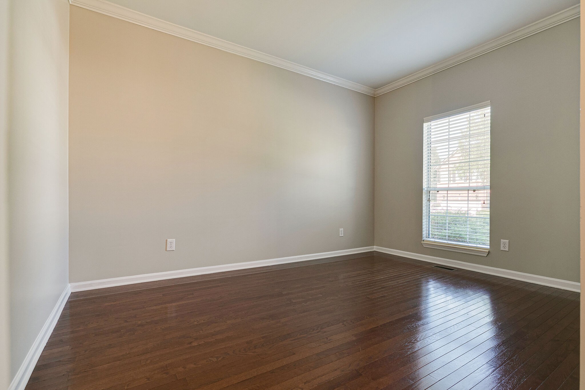 320 Cannonade Circle Franklin, TN 37069 - Photo 6 of 30 a view of an empty room with wooden floor and a window