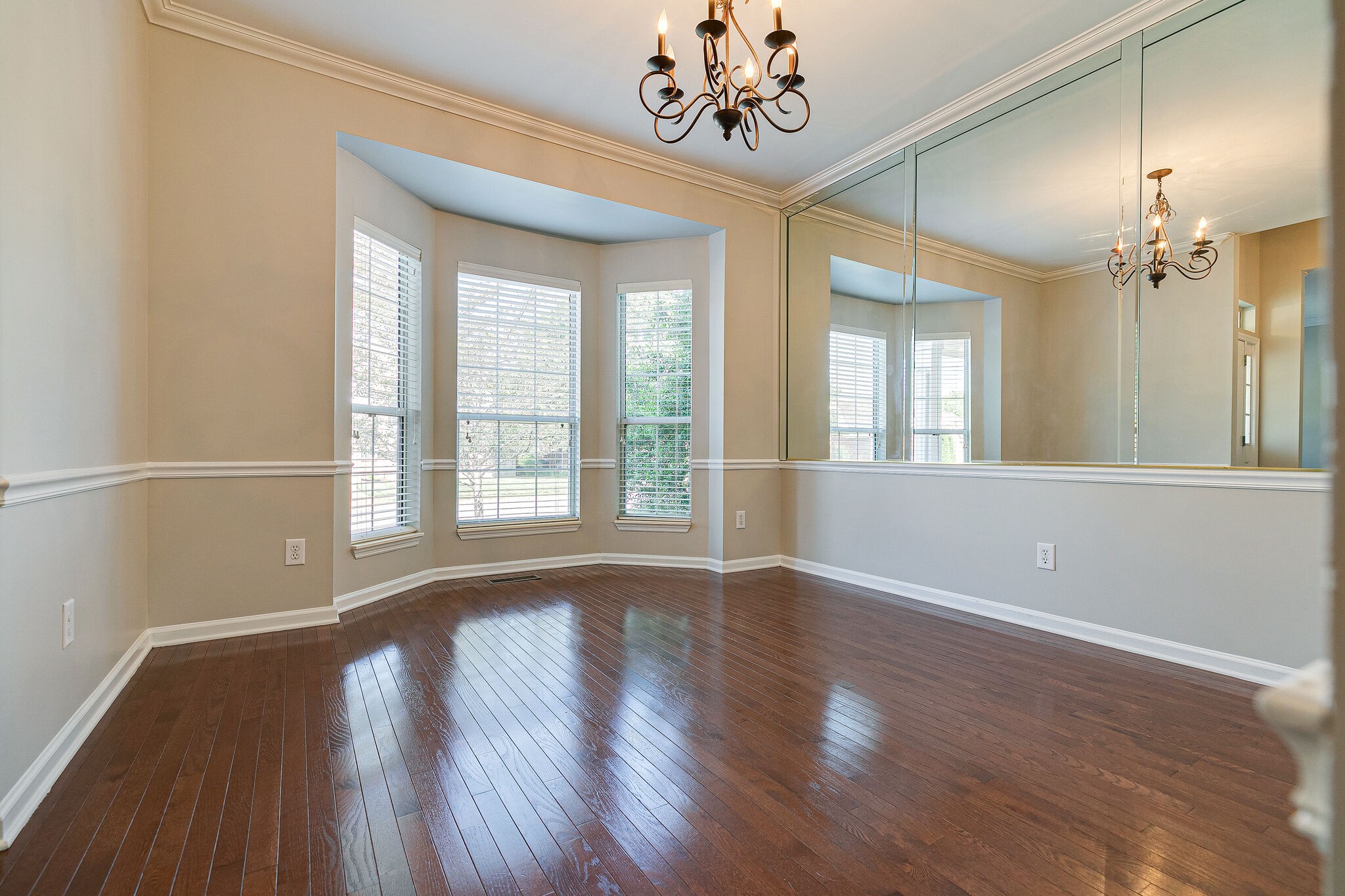 320 Cannonade Circle Franklin, TN 37069 - Photo 7 of 30 a view of an empty room with wooden floor and a window