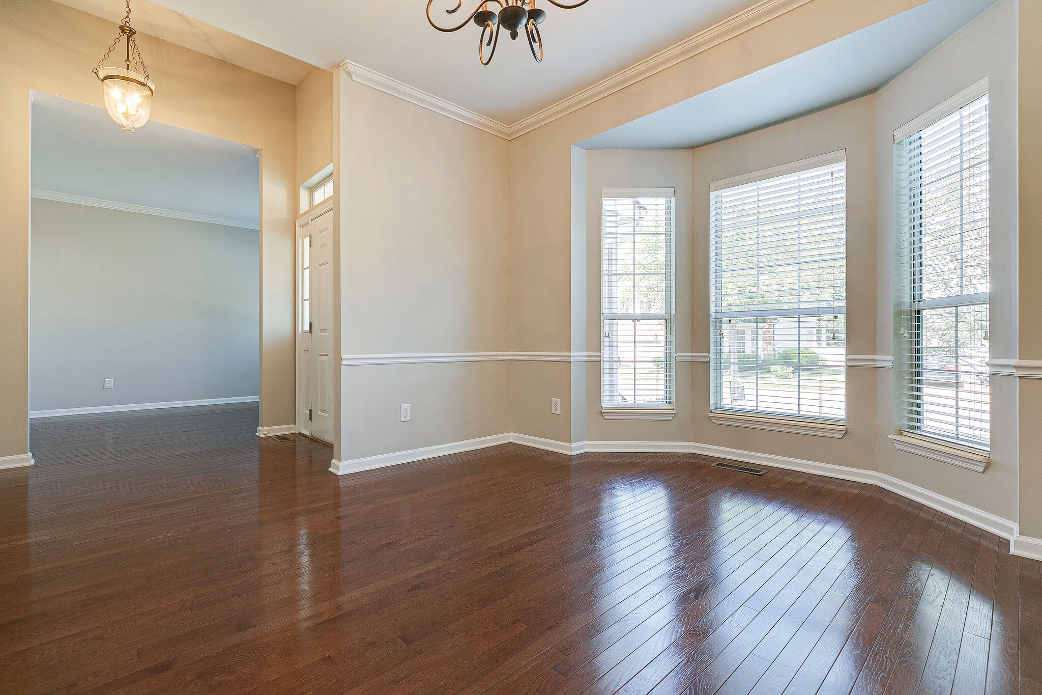320 Cannonade Circle Franklin, TN 37069 - Photo 8 of 30 a view of an empty room with wooden floor and a window