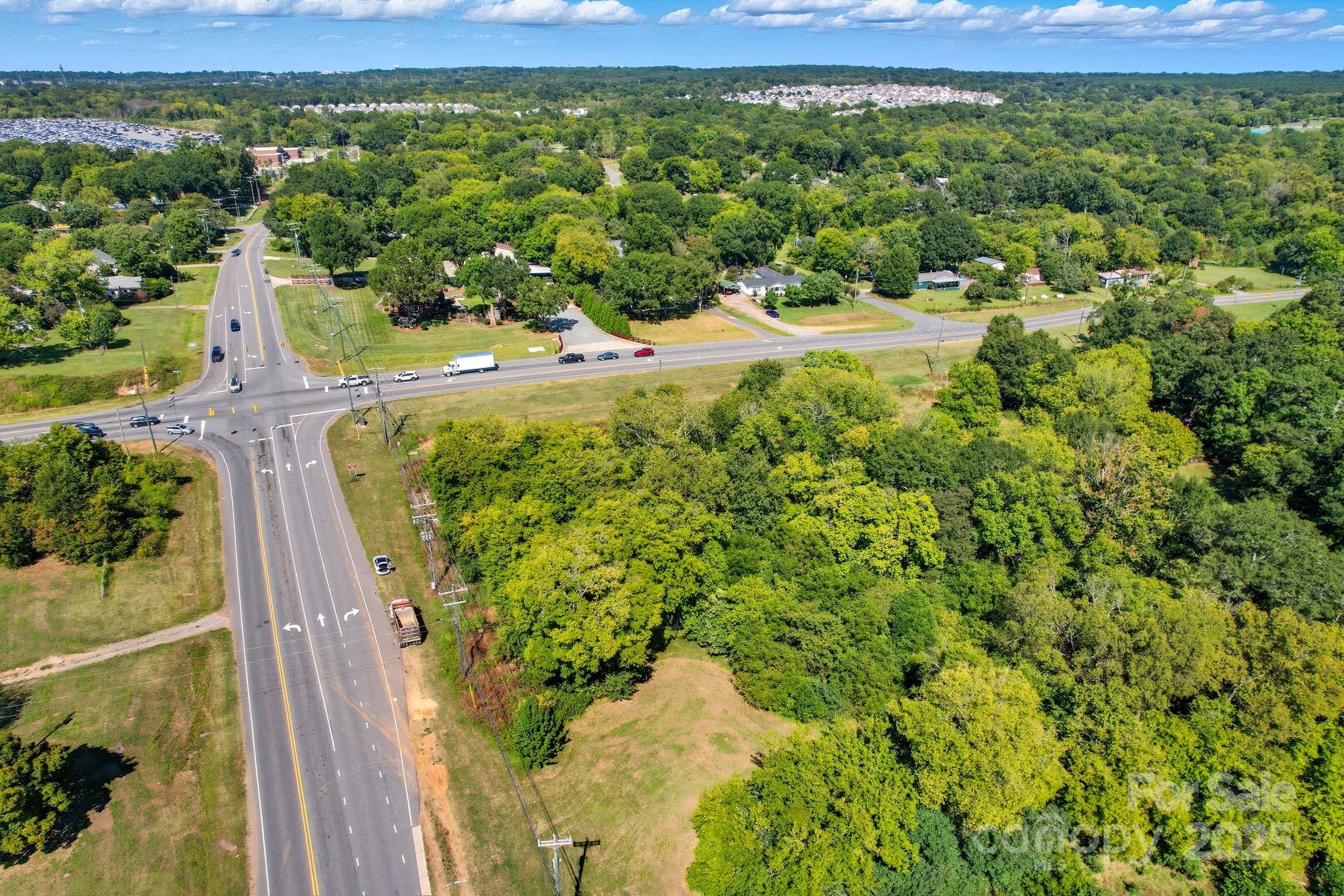 3455 Roberta Road Concord, NC 28027 - Photo 4 of 5 a view of a yard with plants