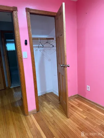 a view of a room with wooden floor and stairs