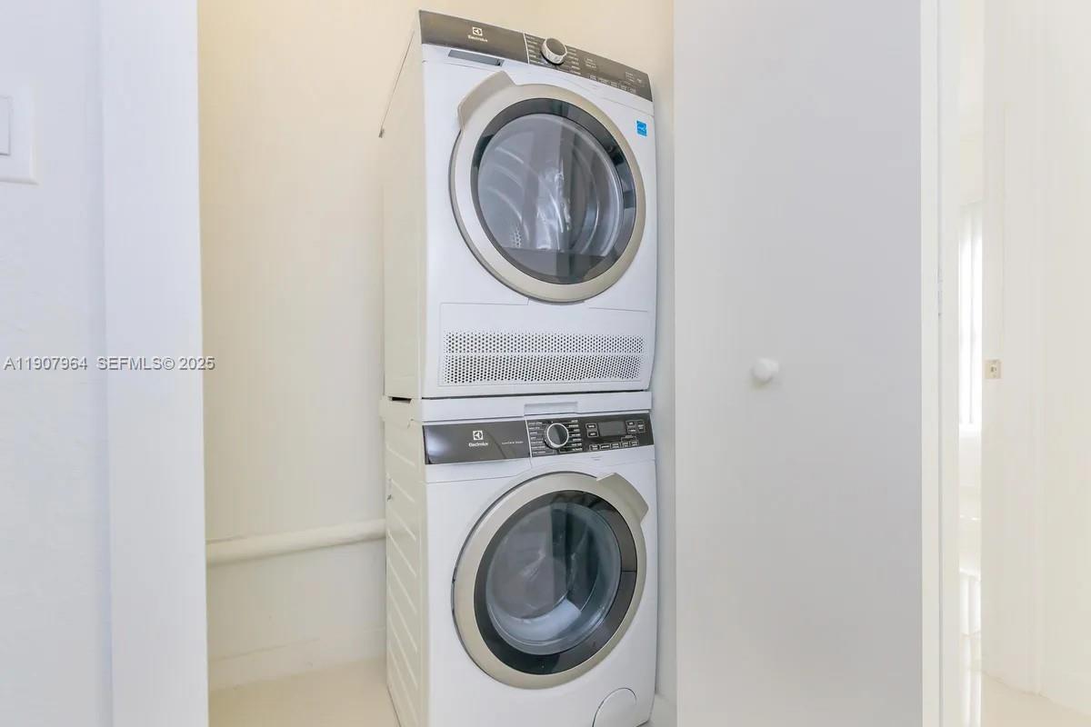 25850 Southwest 140th Court, Unit 6111 Homestead, FL 33032 - Photo 13 of 25 a utility room with dryer and washer