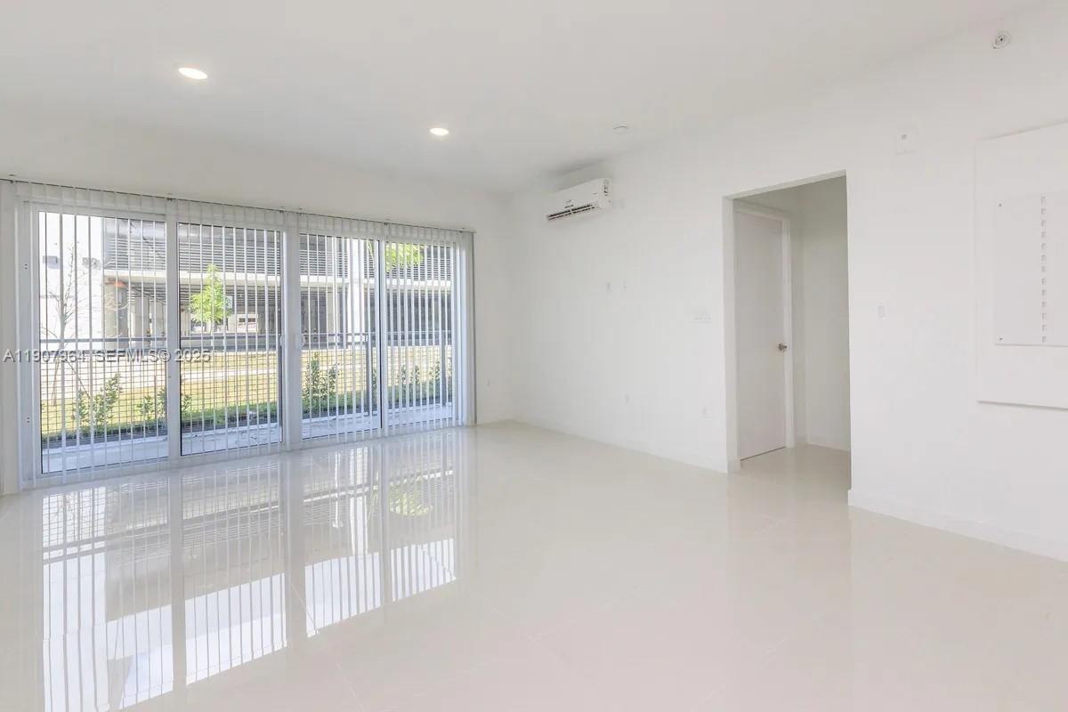 25850 Southwest 140th Court, Unit 6111 Homestead, FL 33032 - Photo 3 of 25 a view of an empty room with a window