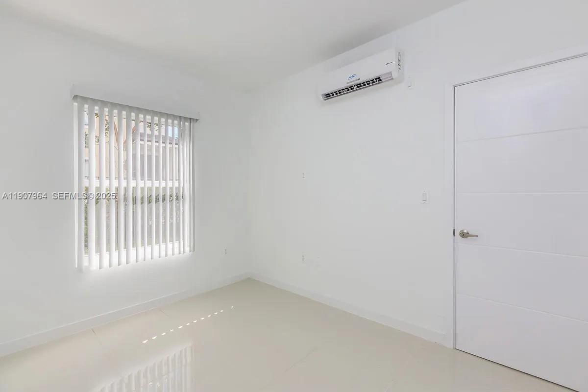 25850 Southwest 140th Court, Unit 6111 Homestead, FL 33032 - Photo 10 of 25 a view of an empty room with a window
